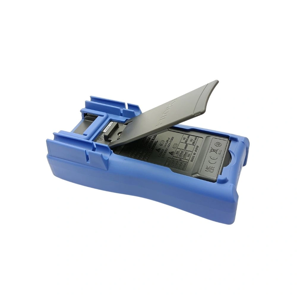 “Rear view of Hioki DT4252 digital multimeter showing the open tilt stand, safety specifications label, and battery compartment”