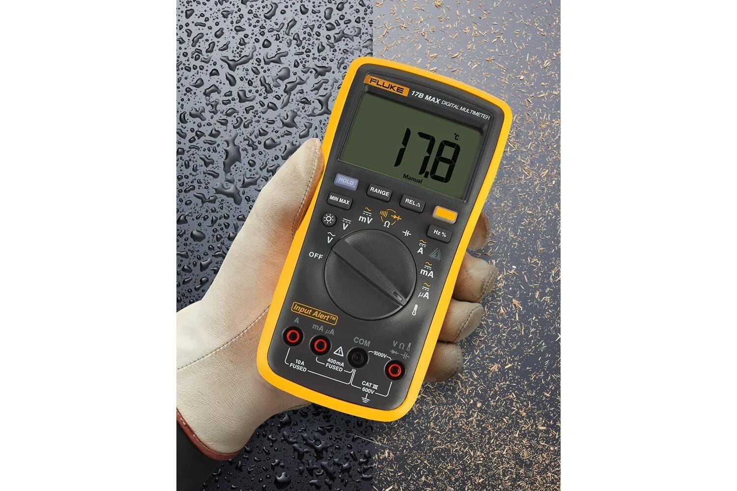 Fluke 17B MAX digital multimeter held in a gloved hand